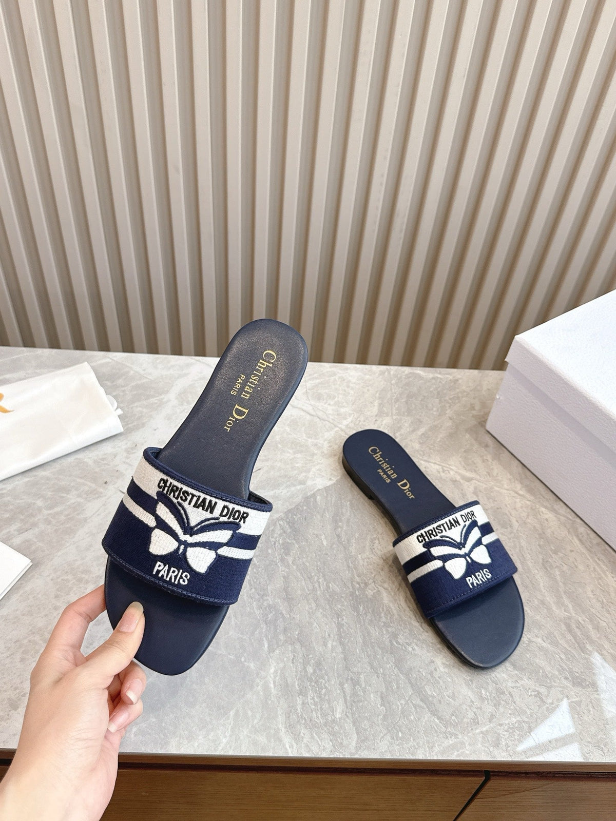 DIOR FLAT SLIDES 25S IN MIDNIGHT BLUE CALFSKIN AND FABRIC EMBROIDERED BUTTERFLY MOTIF